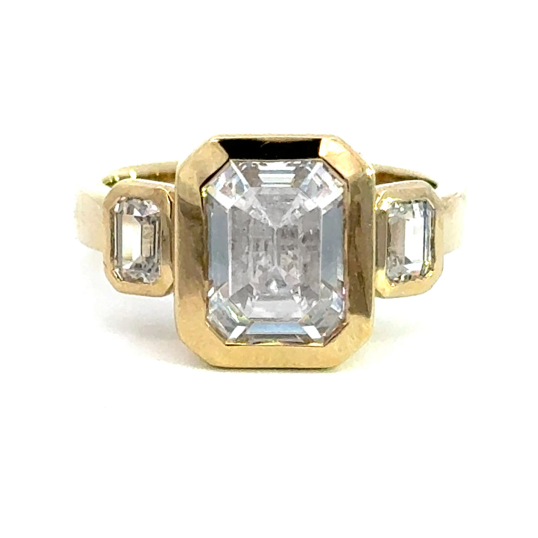 4.2 ctw emerald-cut diamond three-stone bezel wide band engagement ring - Workshop Fine Jewelry