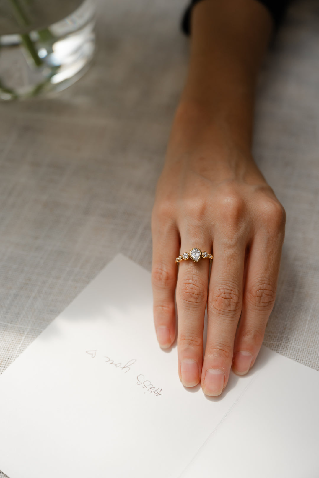 1 ctw pear diamond 7-stone bezel engagement ring
