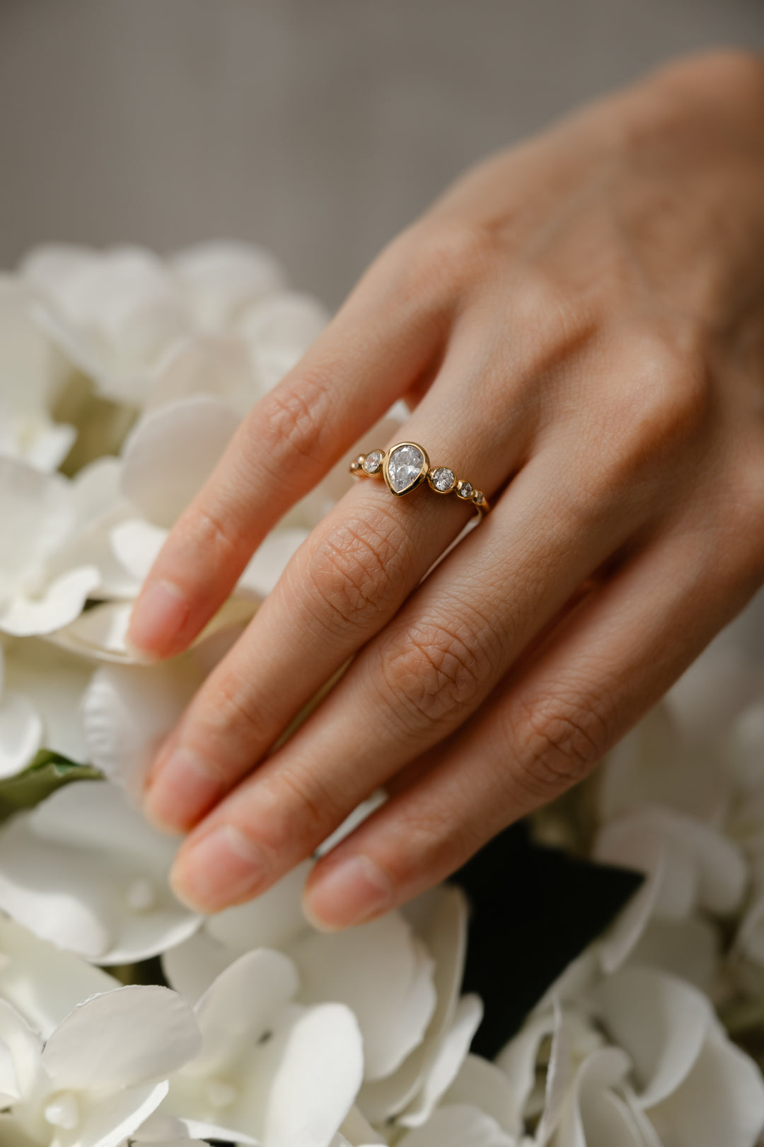 1 ctw pear diamond 7-stone bezel engagement ring