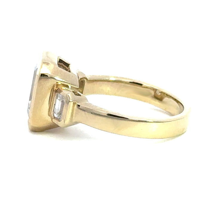 4.2 ctw emerald-cut diamond three-stone bezel wide band engagement ring