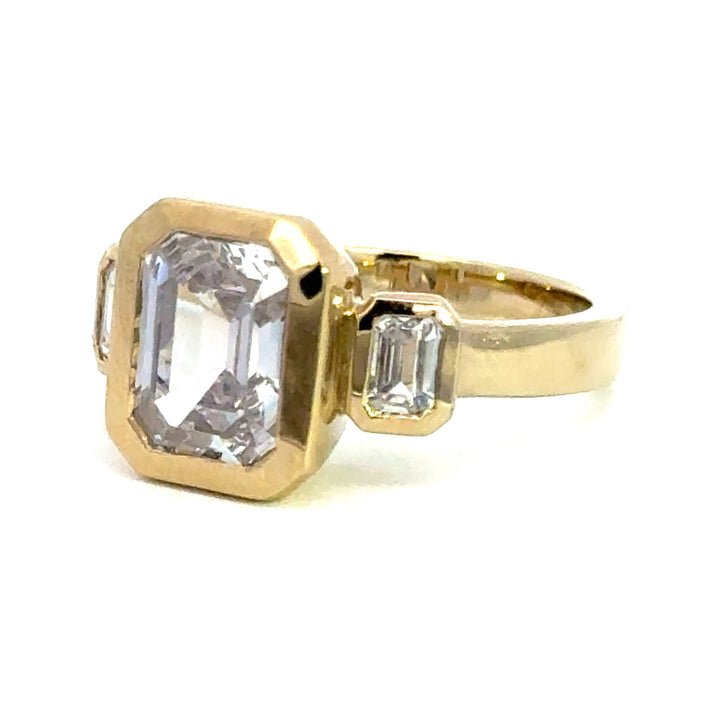 4.2 ctw emerald-cut diamond three-stone bezel wide band engagement ring