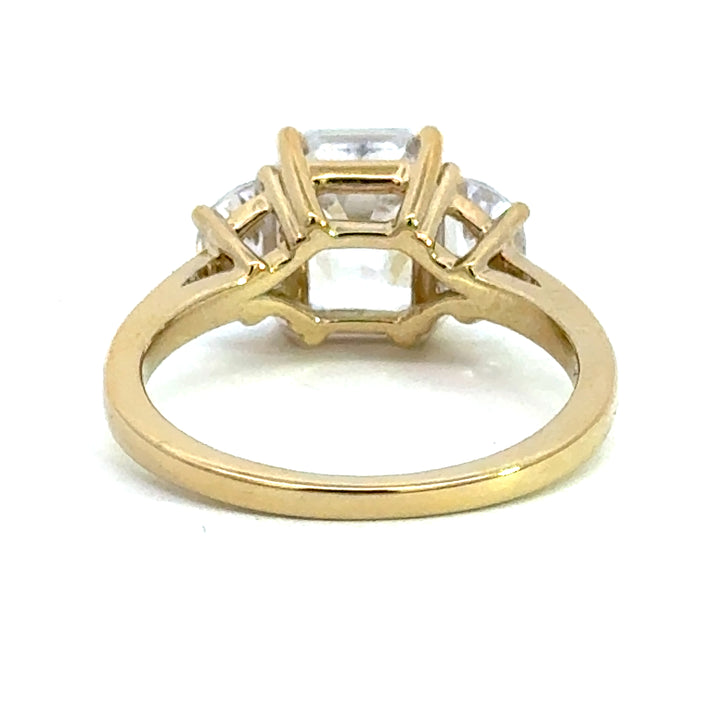 4.0 ctw emerald-cut diamond three-stone mezzaluna half-moon engagement ring