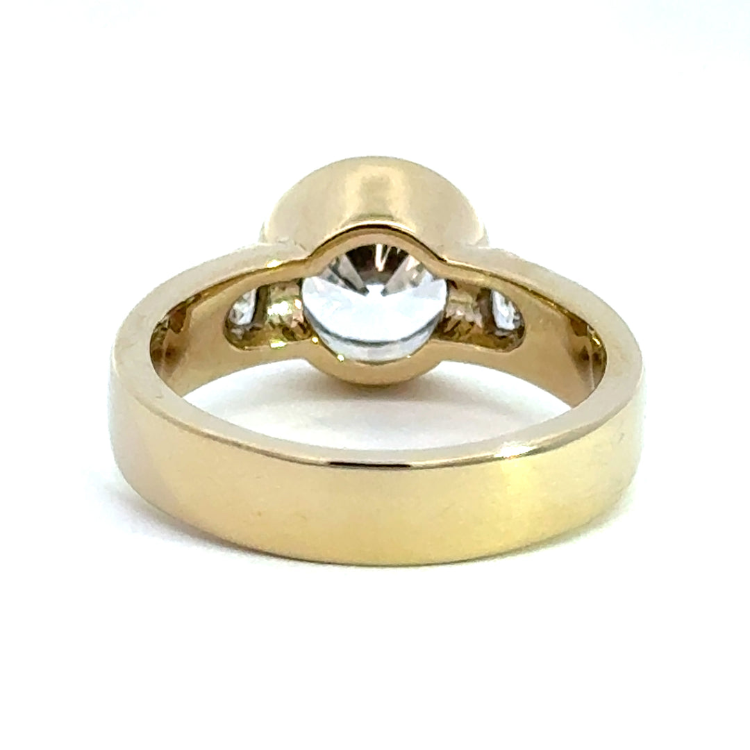2.2 ctw round diamond bezel three-stone trillion wide band engagement ring