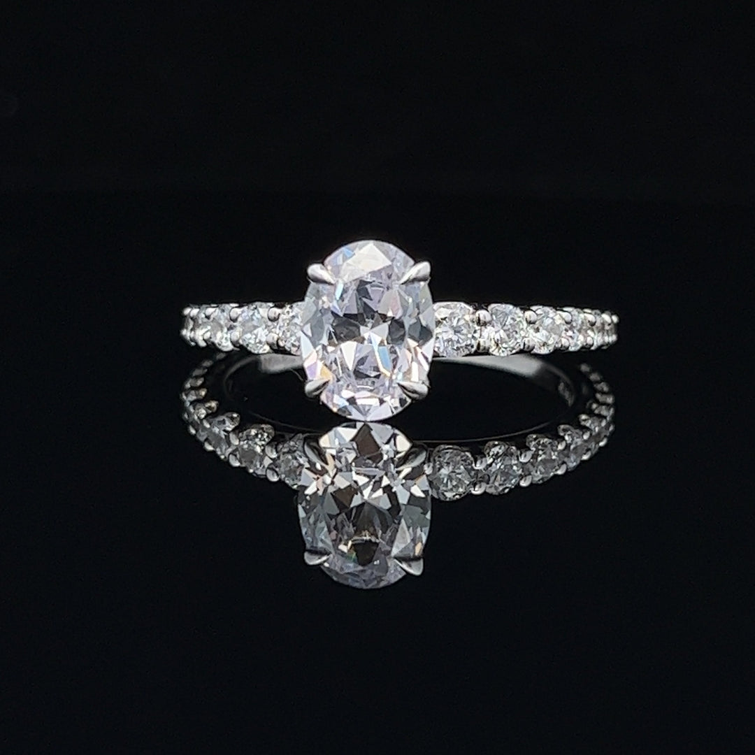 1 1/2 ctw oval diamond engagement ring with graduated diamond accents - workshopunderground.com