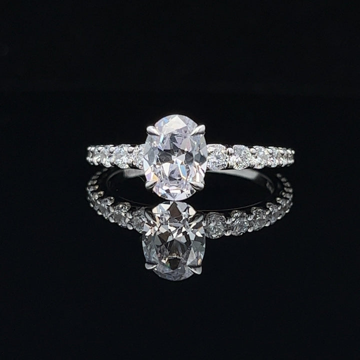 1 1/2 ctw oval diamond engagement ring with graduated diamond accents - workshopunderground.com