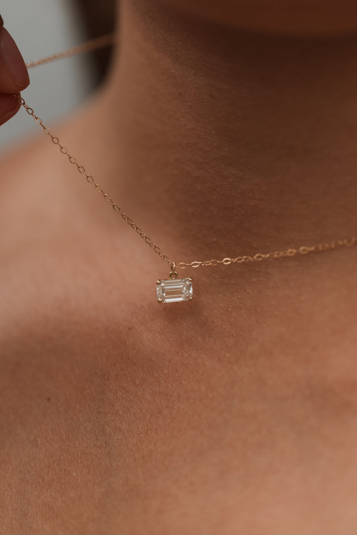 14K east-west emerald cut diamond necklace