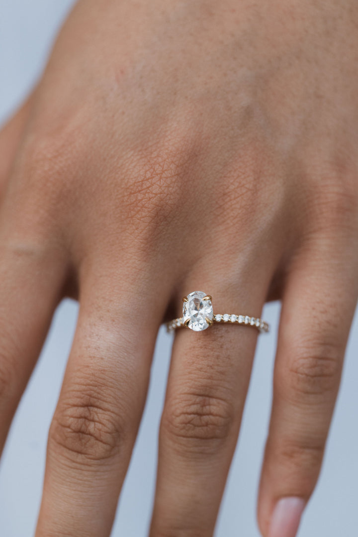 1 1/2 ctw oval diamond engagement ring with pave accents & hidden collar