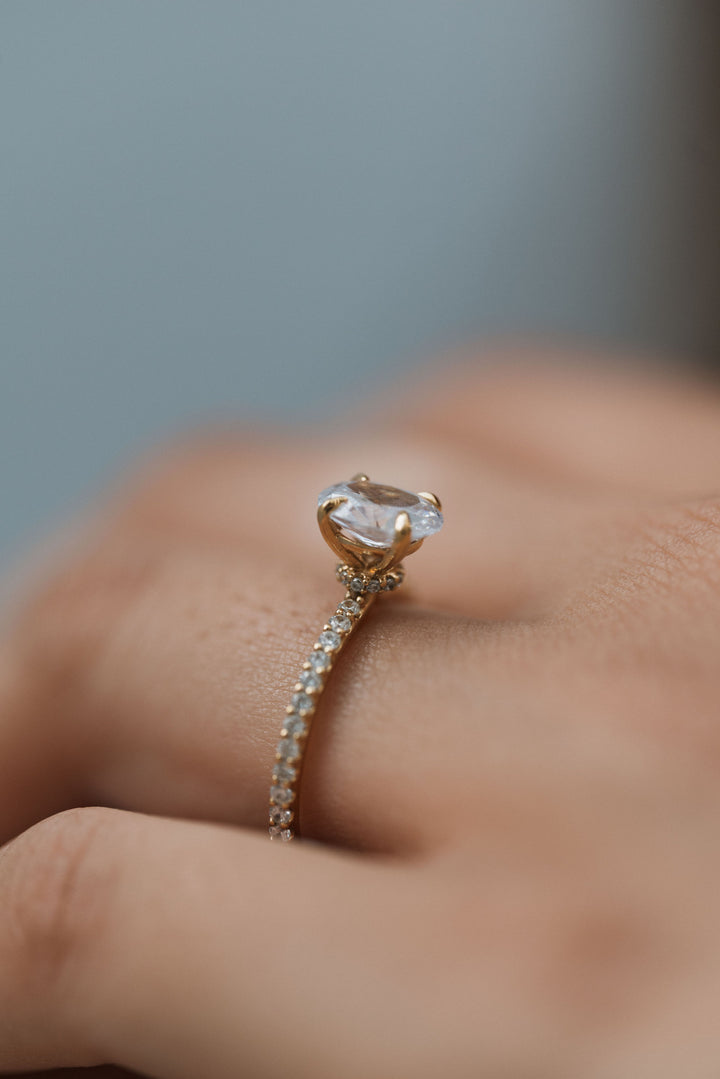 1 1/2 ctw oval diamond engagement ring with pave accents & hidden collar