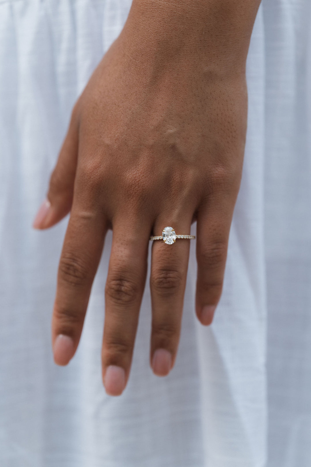 1 1/2 ctw oval diamond engagement ring with pave accents & hidden collar