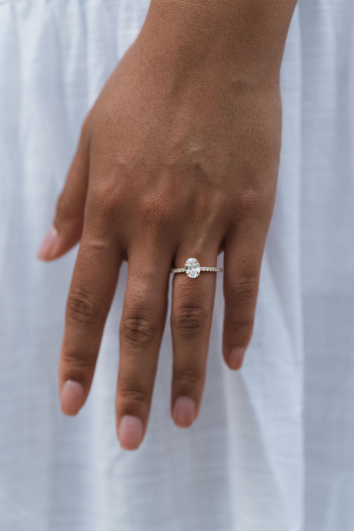 1 1/2 ctw oval diamond engagement ring with pave accents & hidden collar