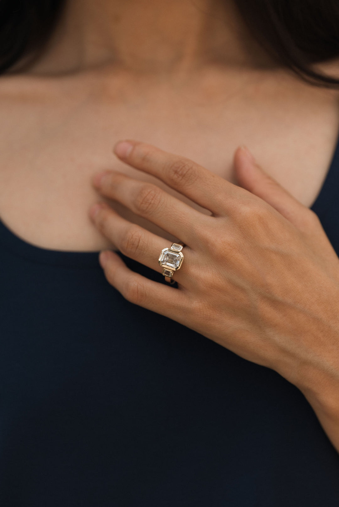 4.2 ctw emerald-cut diamond three-stone bezel wide band engagement ring