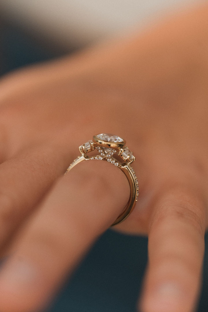 4.1 ctw oval diamond three-stone bezel pentagon with pave band engagement ring