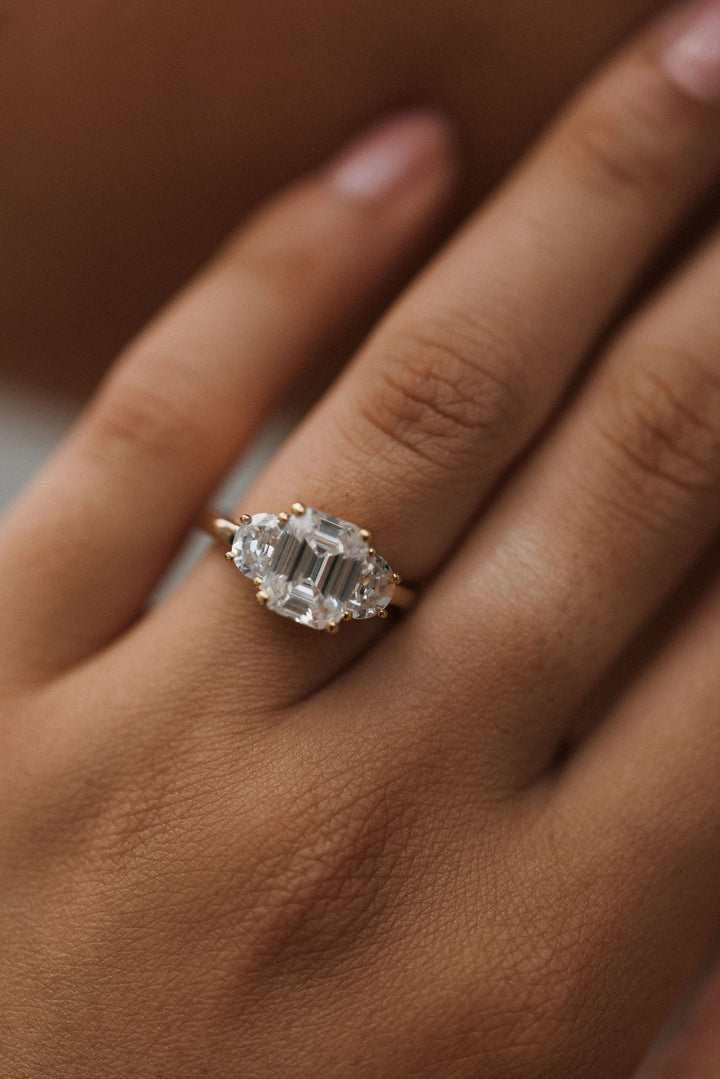 4.0 ctw emerald-cut diamond three-stone mezzaluna half-moon engagement ring