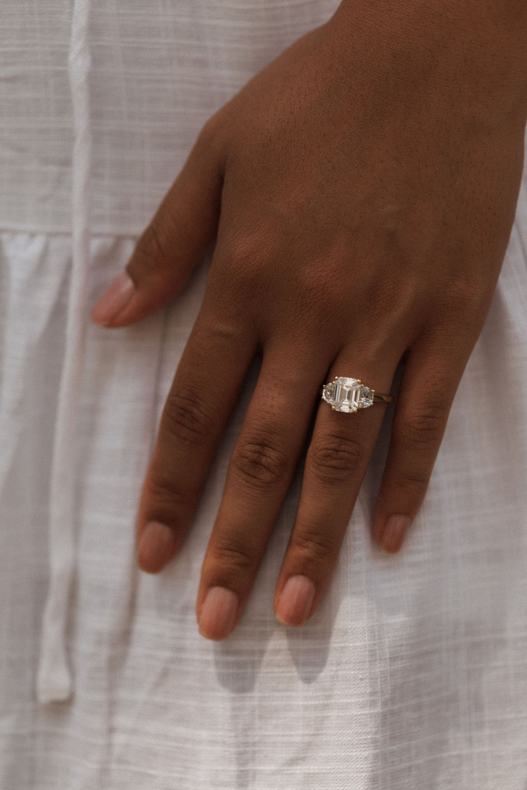 4.0 ctw emerald-cut diamond three-stone mezzaluna half-moon engagement ring