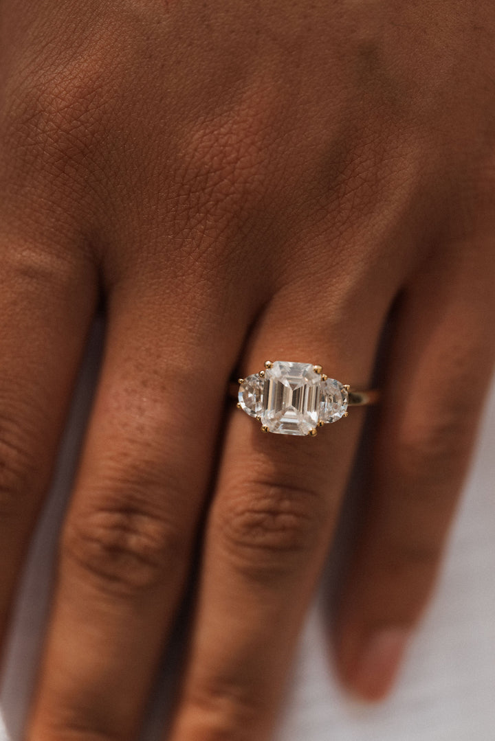 4.0 ctw emerald-cut diamond three-stone mezzaluna half-moon engagement ring