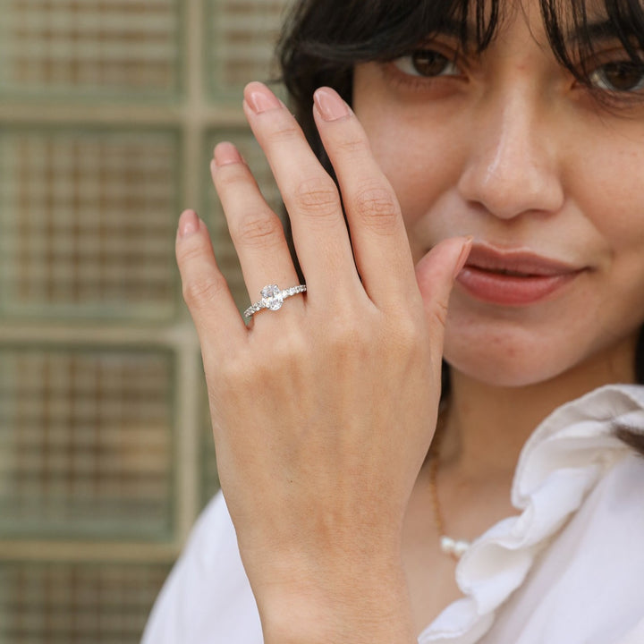 1 1/2 ctw oval diamond engagement ring with graduated diamond accents
