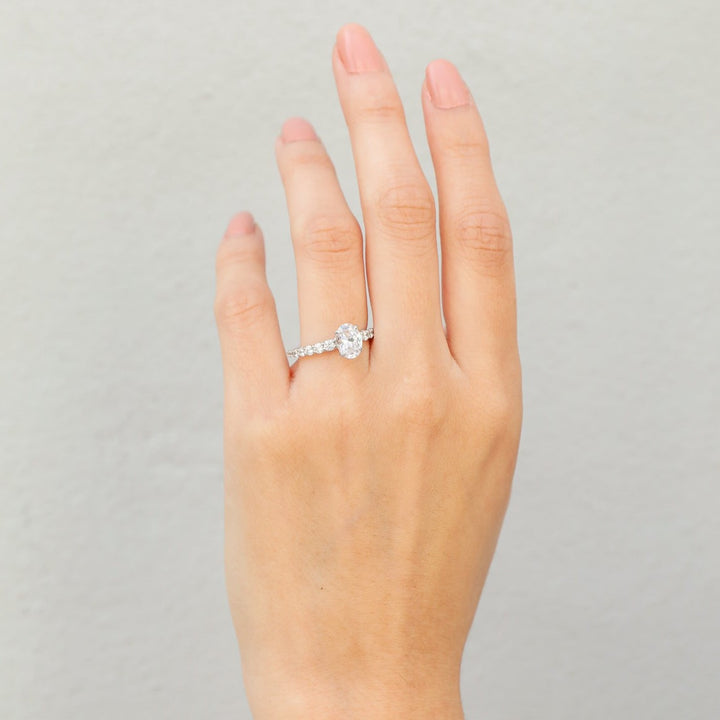 1 1/2 ctw oval diamond engagement ring with graduated diamond accents