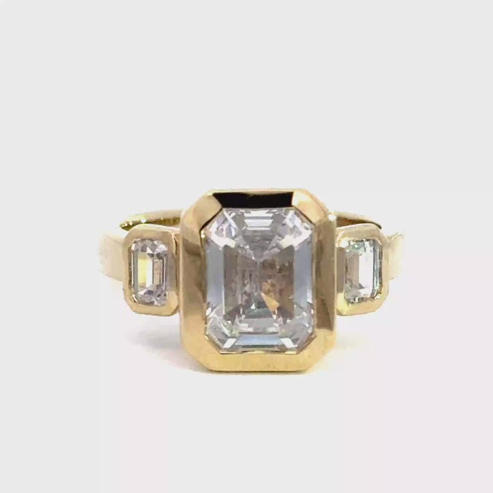 4.2 ctw emerald-cut diamond three-stone bezel wide band engagement ring