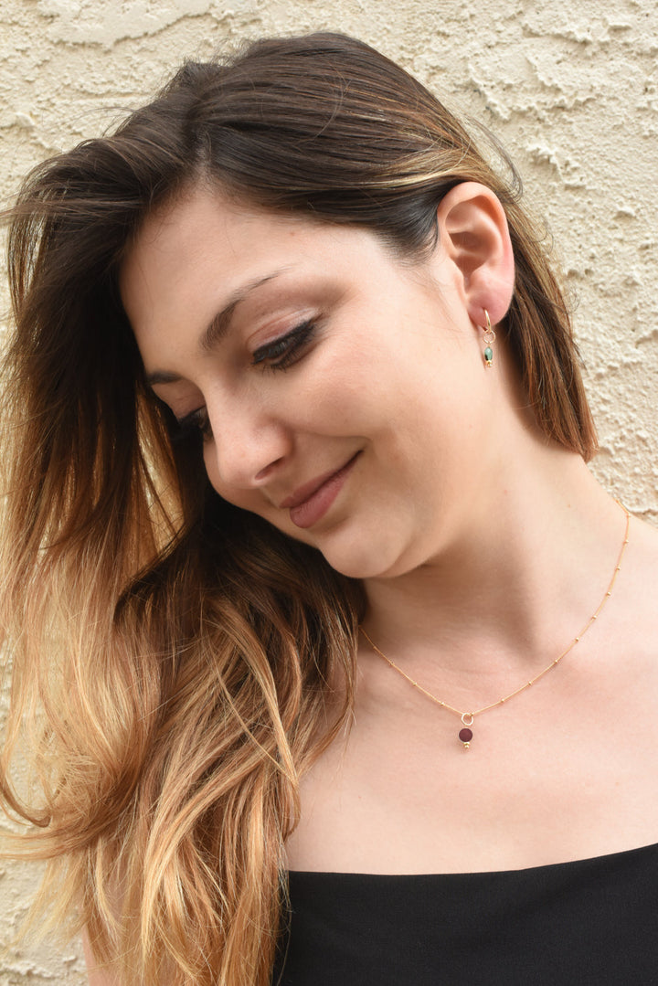 golden rondelle necklace - garnet coin charm - workshopunderground.com